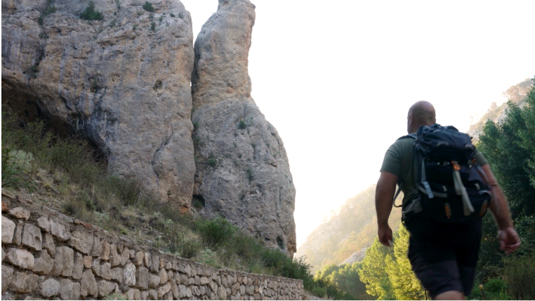 Understanding PAD: Man hiking through mountains